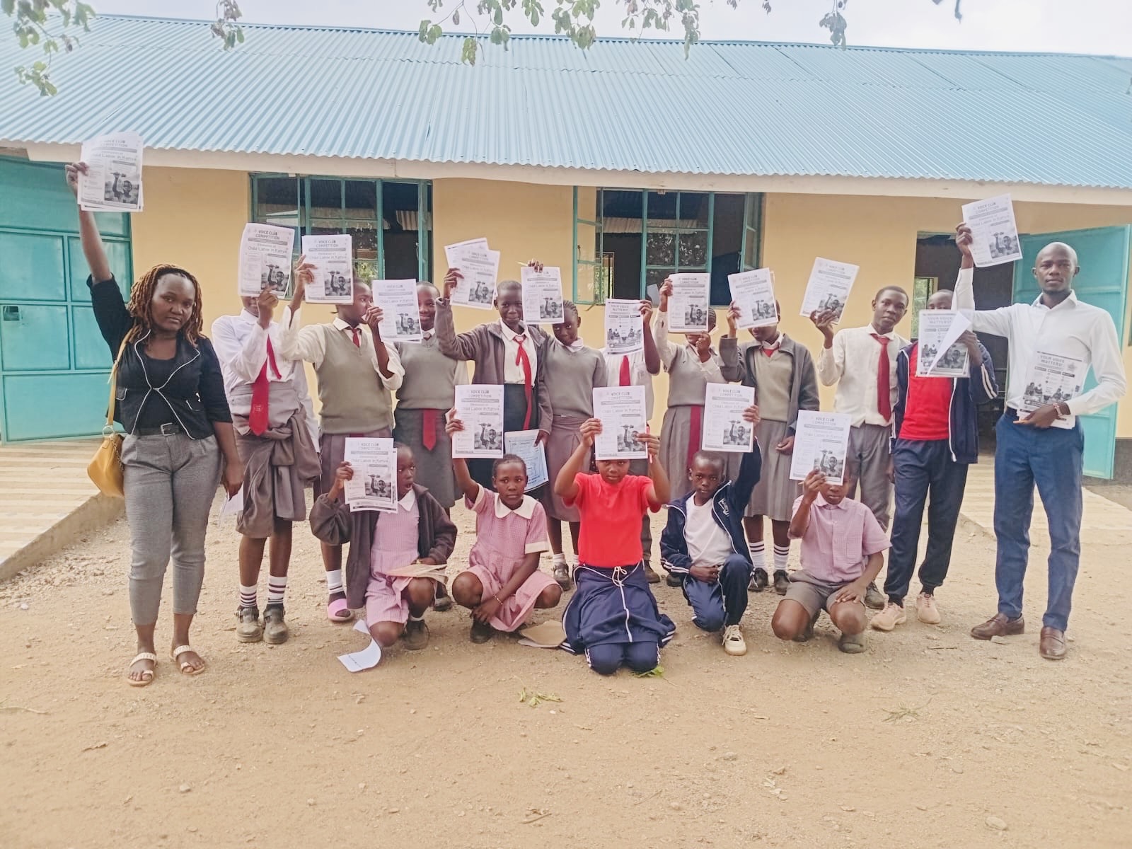 VOICE Club members at Angoro Comprehensive School holding their essay publications